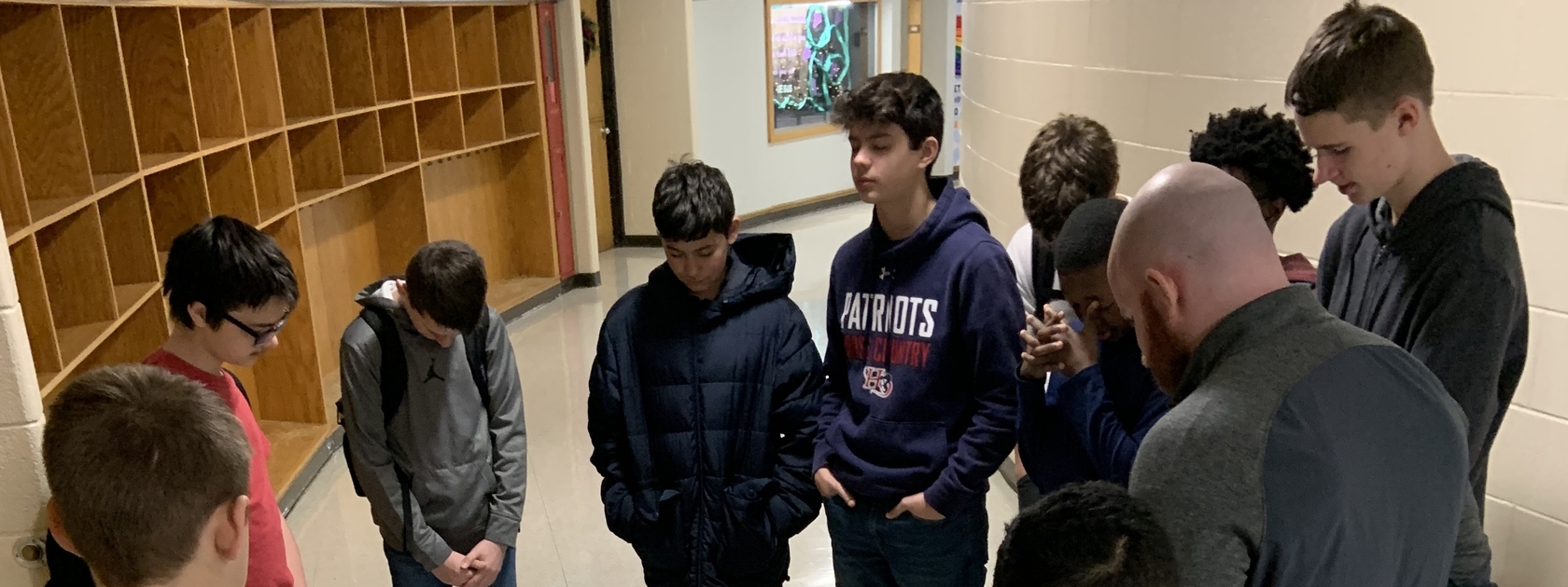 Student and Teacher Praying